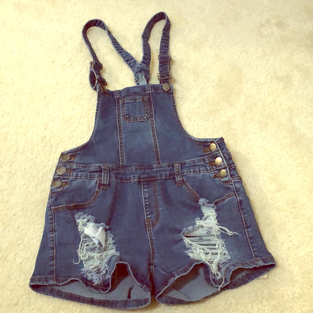 Distressed denim overalls